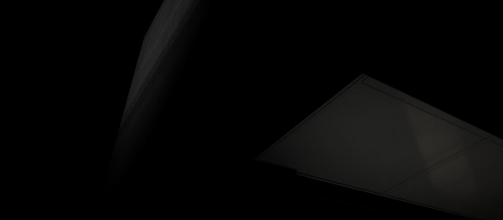 Dark architectural facade at night