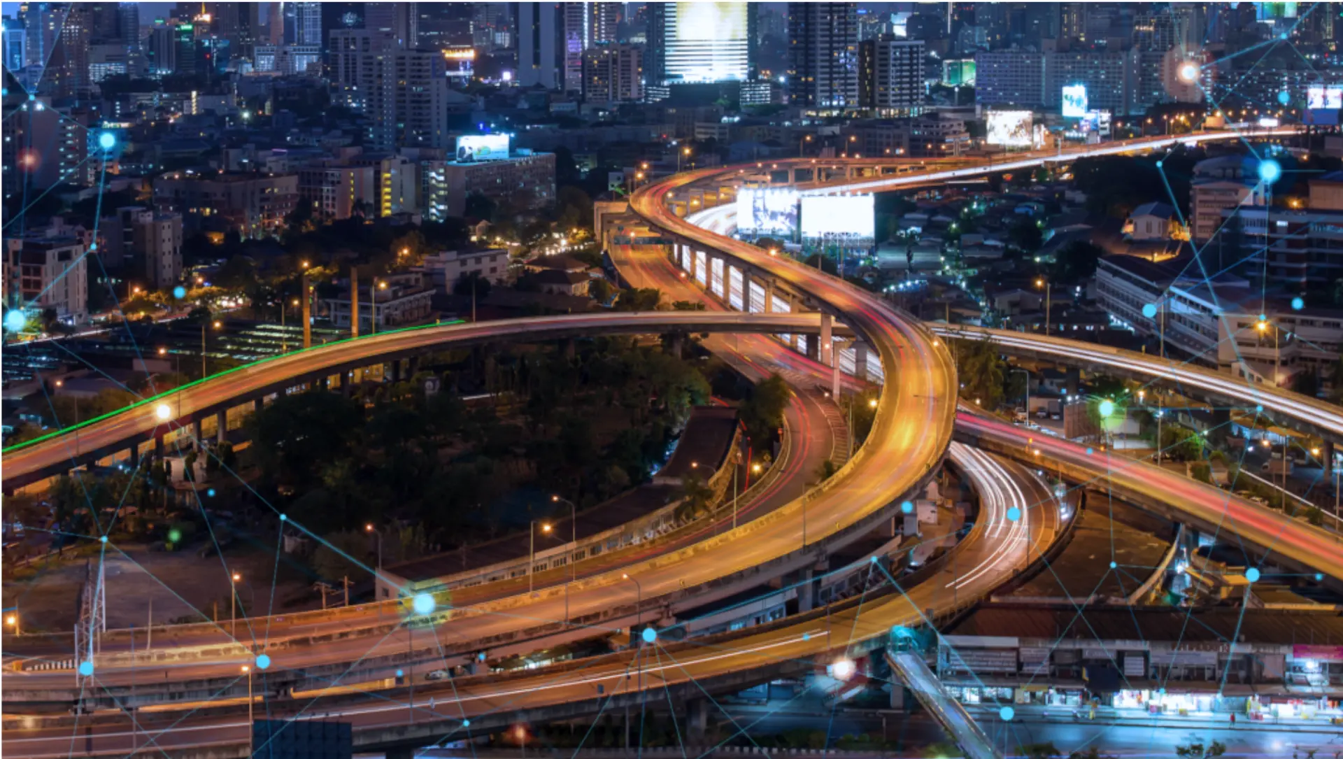 Multi-level urban highway interchange with smart city network overlay at night
